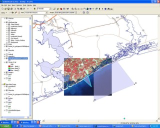A map of a coastline and nearby estuaries, with an inset rectangle displaying a satellite image of the area.