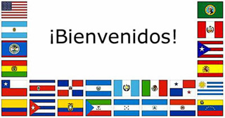 A collection of flags from Spanish-speaking countries with the greeting, "Bienvenidos."